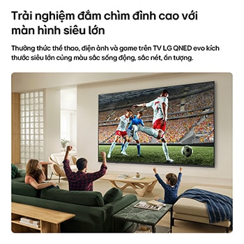 LG QNED evo AI QNED82 Mini LED Ultra Big TV shows an intense, large-scale soccer play with refined picture quality and vivid colors as a family cheers together from sofas in a living room.